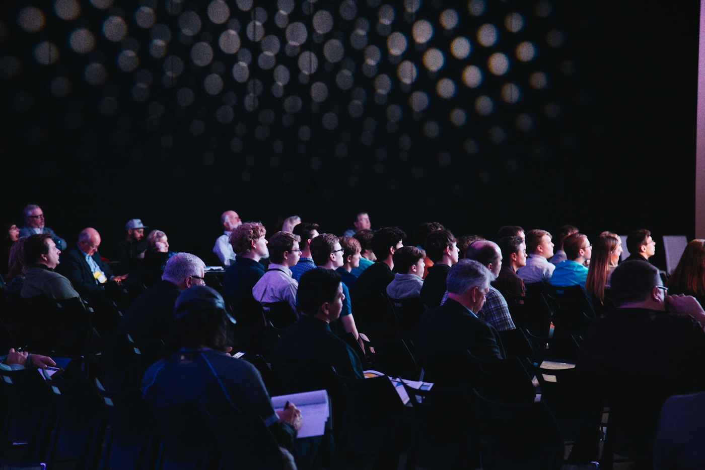 Conference audience listening to a speaker