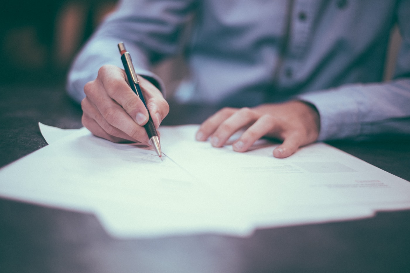 Professional documents and agreement review on a desk